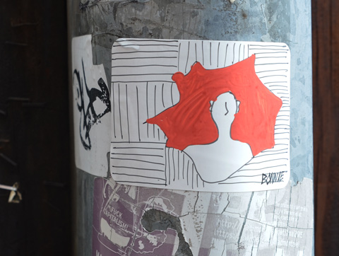 hand drawn sticker of a person's head and torso on a red background with black and white lines behind 
