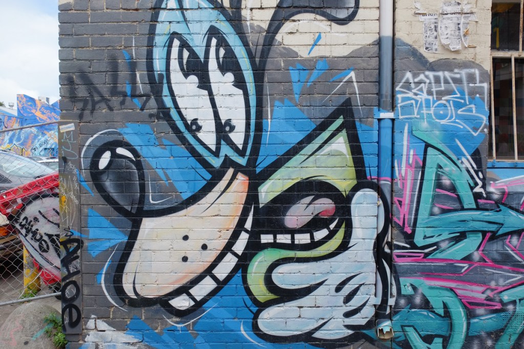 mural of a dog's head in blue with a large nose