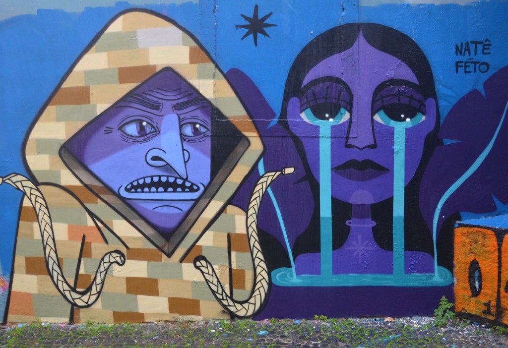 street art mural, a couple, man and woman, both with purple skin