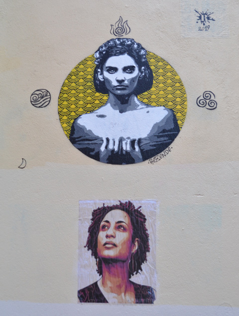 two street art portraits of women