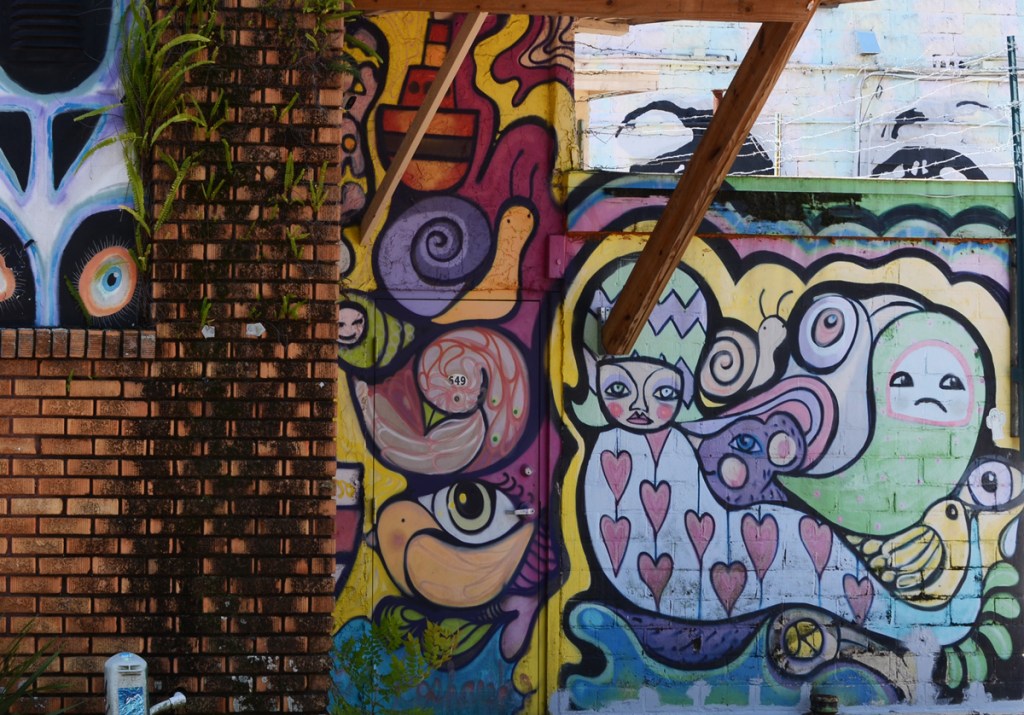 mural in an alley by kosharekart