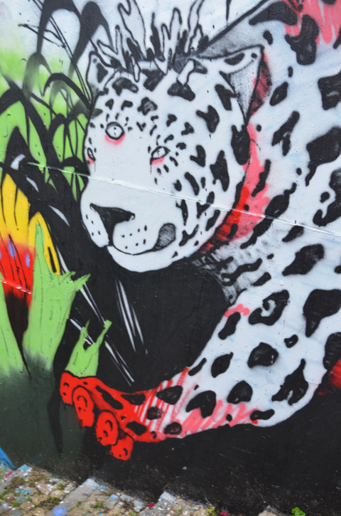 street art of a black and white leopard