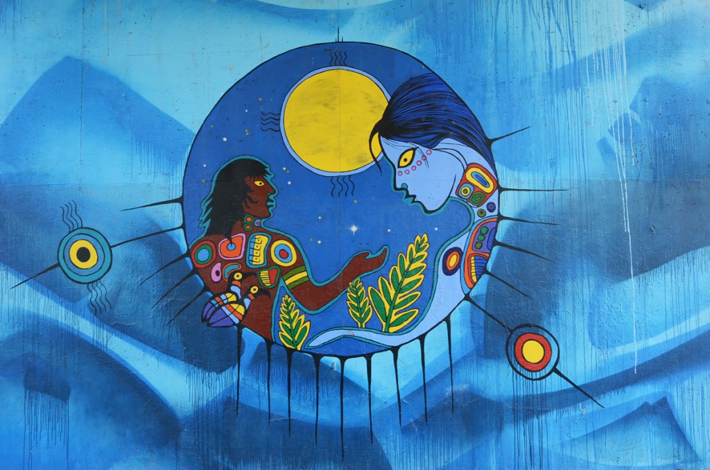Philip Cote Anishinaabe mural of water and spirits on concrete pillar