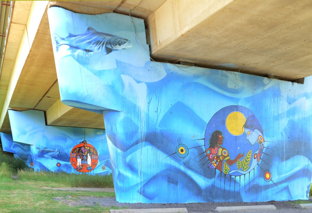 Philip Cote Anishinaabe mural of water and spirits on concrete pillar