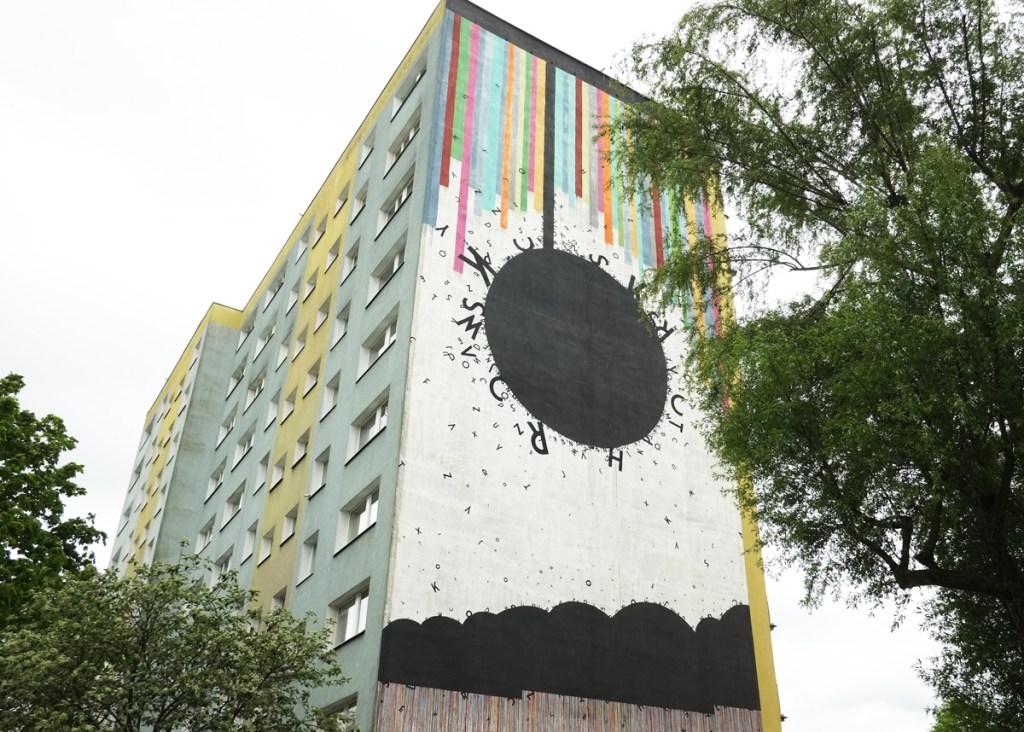 mural by opiemme on the end of an apartment block in Gdansk