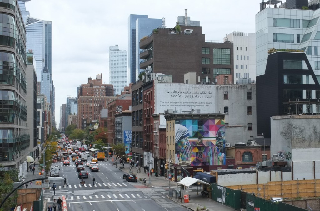 view of 10th Avenue in Manhattan from the High Line park, including a Kobra mural of Mother Teresa and Gandhi