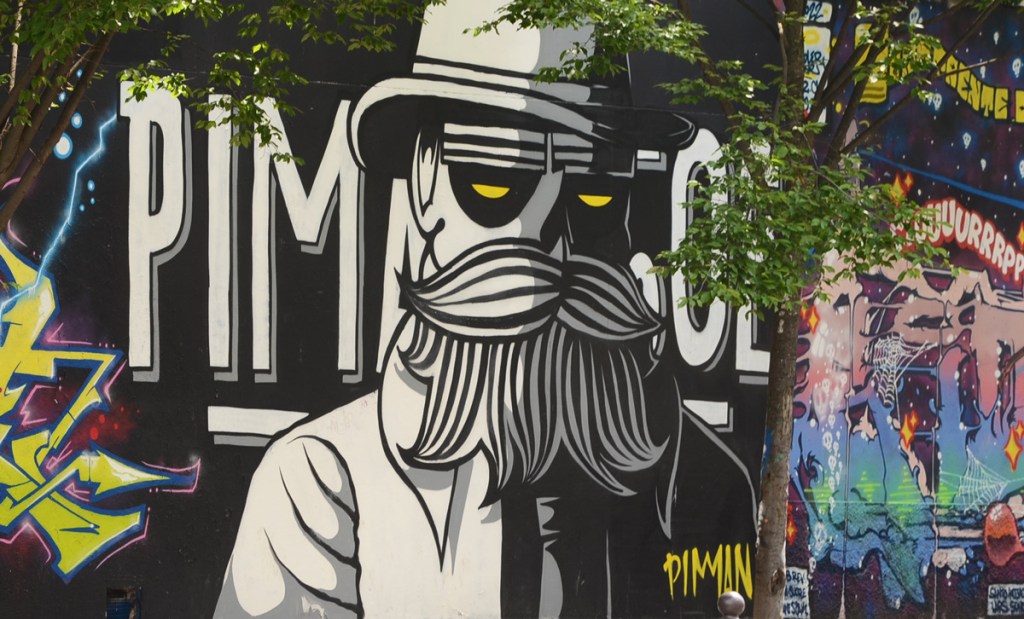 mural of black and white character by artist Piman 50 cl
