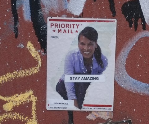 graffiti by sticker maul using united states postal service priority mail stickers.