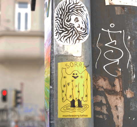 sticker, a ghost with the word sorry, ad advert for sorry tattoo 