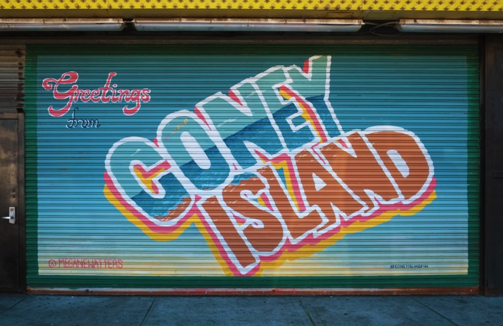 postcard style mural, greetings from Coney Island, with images in the letters