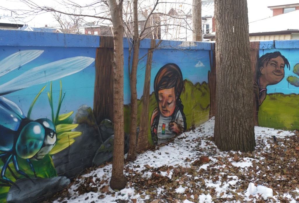 corner of wall, interior angle, with mural painted on it