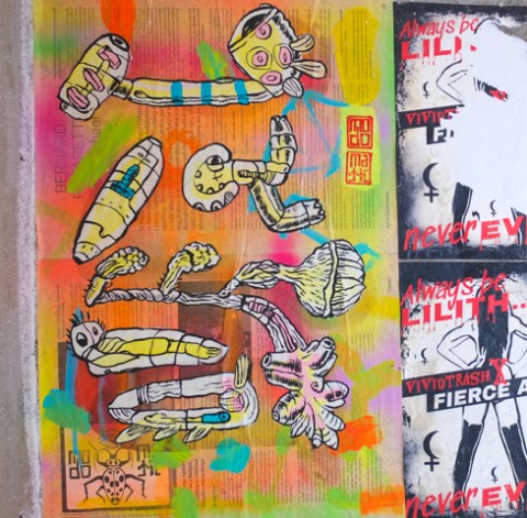 colourful poster graffiti by modomatic, on printed newspaper