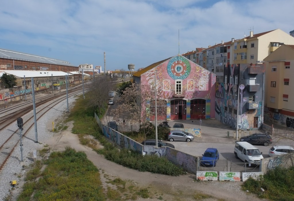 view from bridge, ADAO headquarters, an old industrial site, with street art murals on it