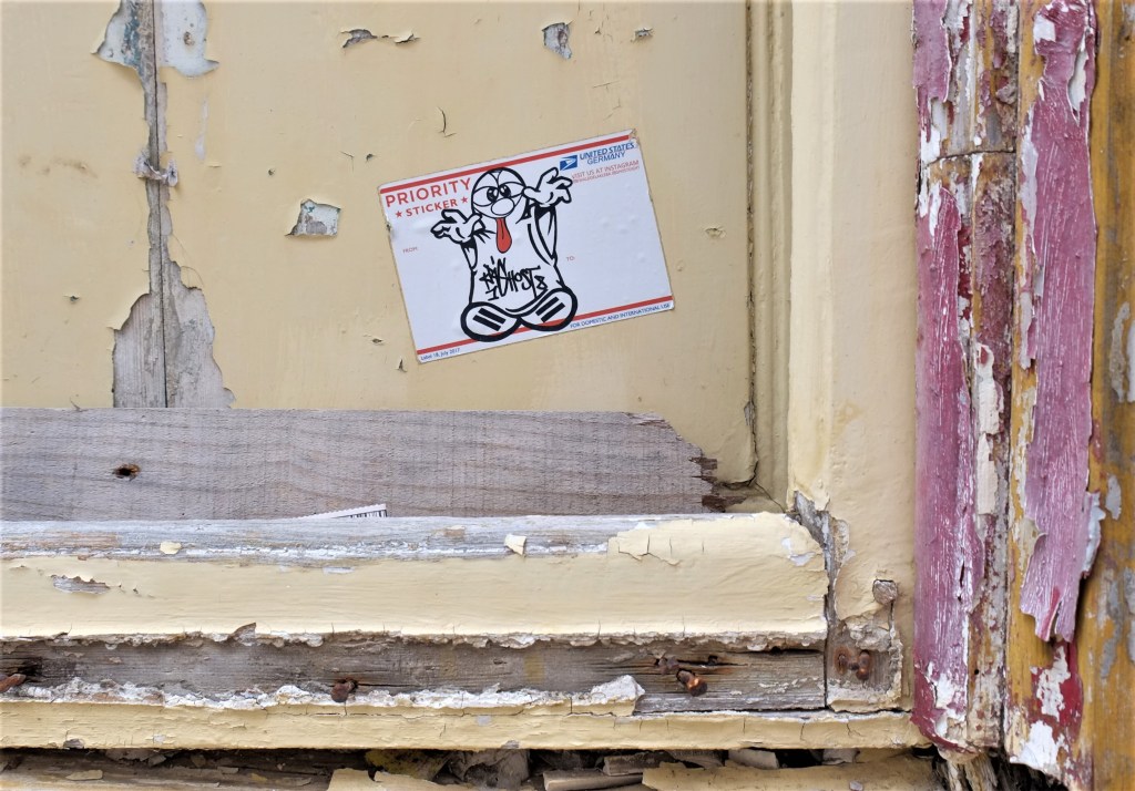 graffiti made with a USA Mail priority sticker