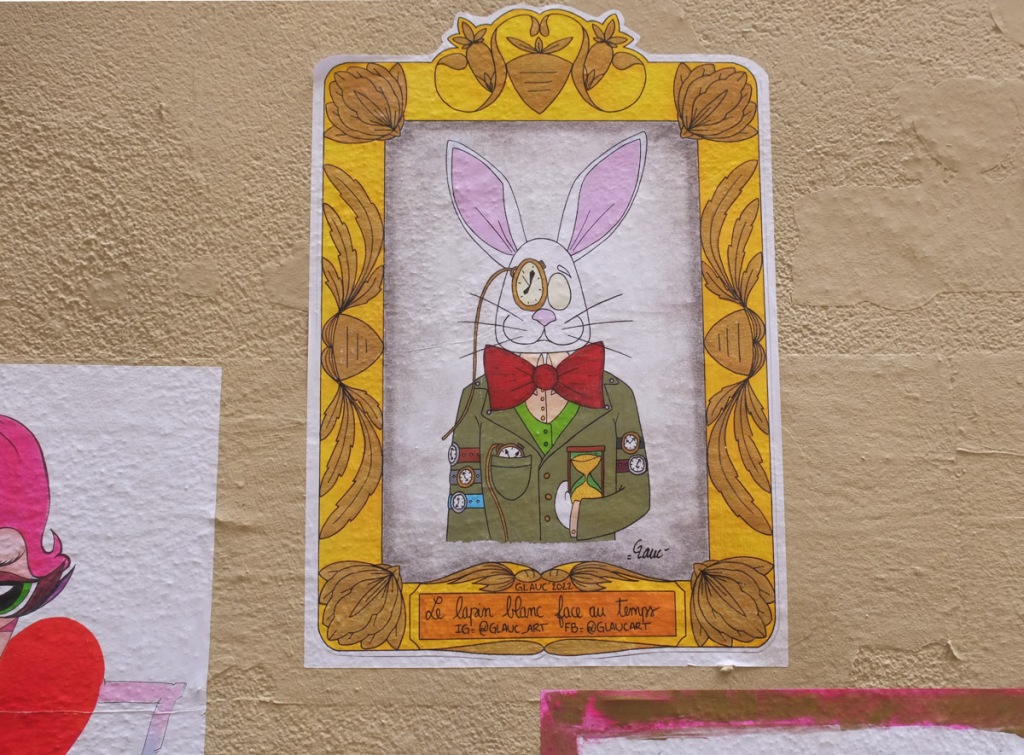painting of  a white rabbit with a pocket watch over one eye, a big red bowtie, an egg timer in one hand, 5 wrist watches around his arm, long white ears, a green jacket