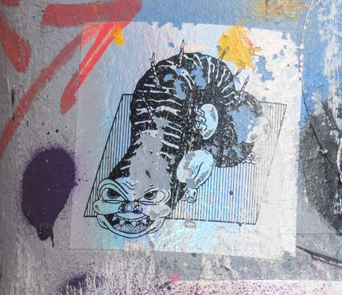 slap on a pole, black and white and grey tones, part snrling cat, part snake, part caterpilar