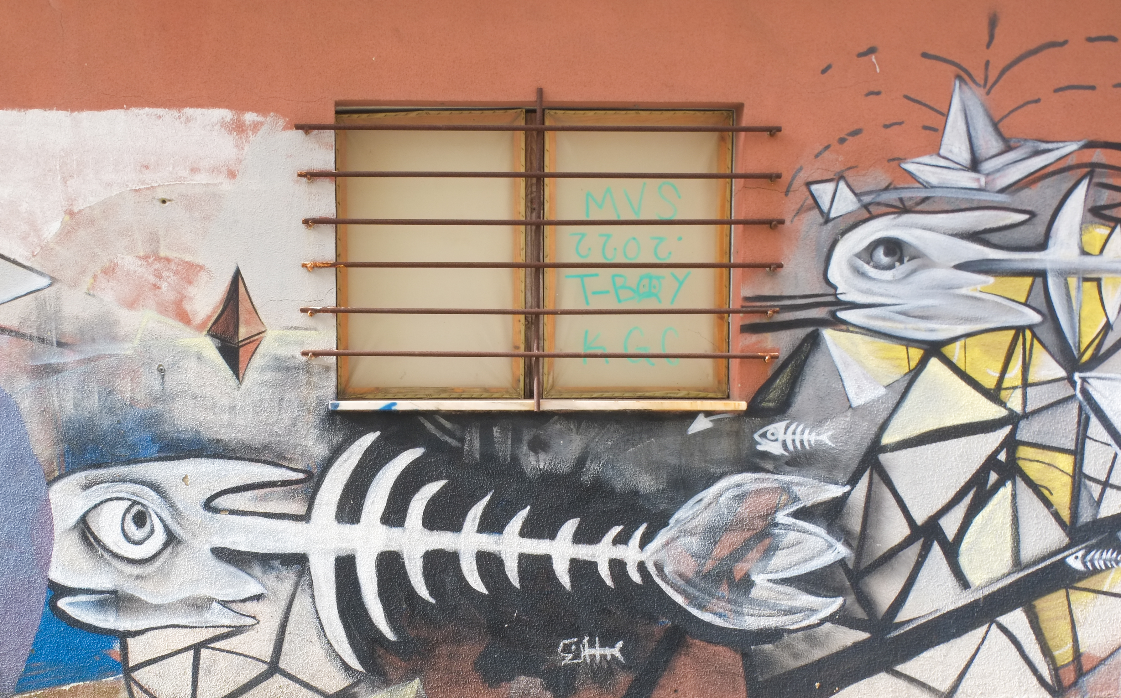 street art mural, large fish showing just the bones
