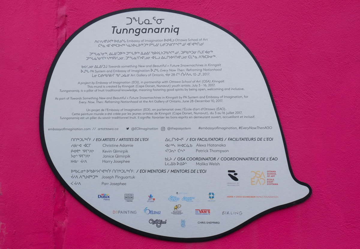 text bubble on pink background for a street art mural with title tunnganarniq, an Inuit word for inclusivity and positivity