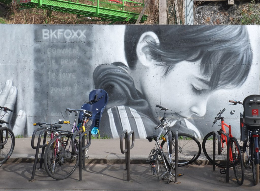 portrait of a young boy in shades of grey, street art mural, with his eyes closed, side view, very realistic