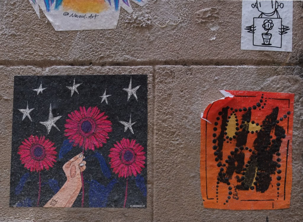 wheatpaste paste ups on a wall