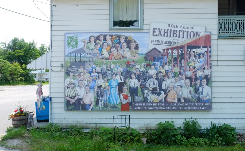 large mural on the side of general store in Parham Ontario, image of a group of people at the 59th annual Exhibition and Parham agricultural fair, early 1900sm