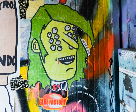 sticker by Sold Out Art Show, picture of a man with 14 eyes, green hair