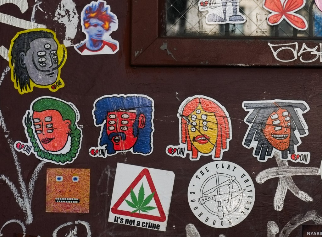 sticker by Sold Out Art Show, picture of a man with 7 eyes