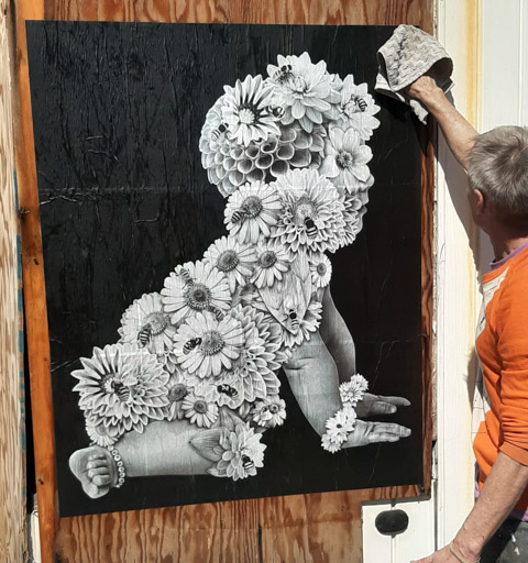 black and white paper wheatpaste on exterior wall, by crookshank, baby crawling, covered with flowers with lots of large petals, many bees flying around and some landing on the flowers, flower power baby