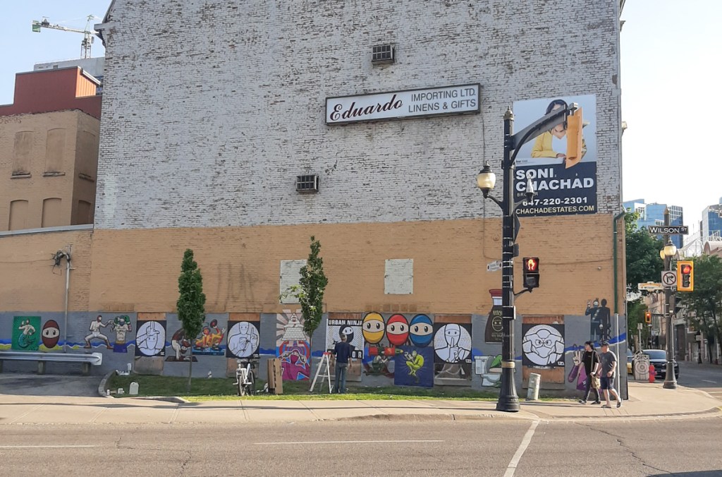 old abandoned building, with ground floor level covered with images by urban ninja squadron, hamilton ontario, james and wilson