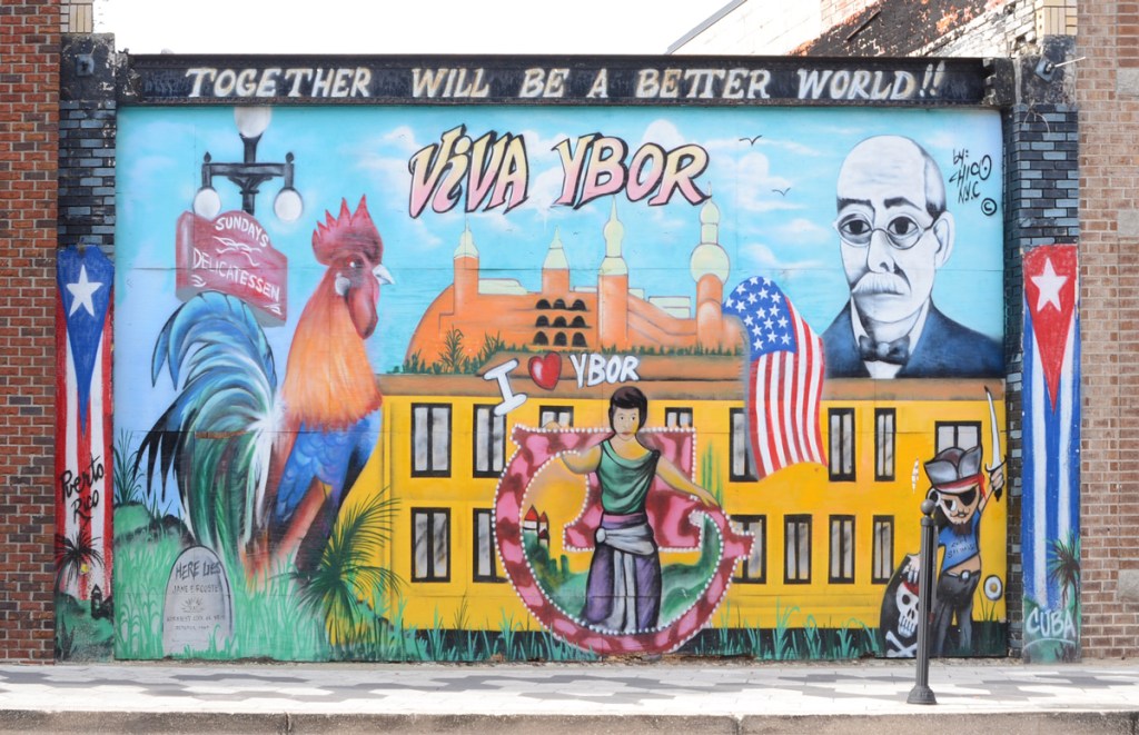 Viva Ybor mural with Cuban flags, a rooster, I love Ybor, a portrait of Vincente Ybor for whom the city is named after