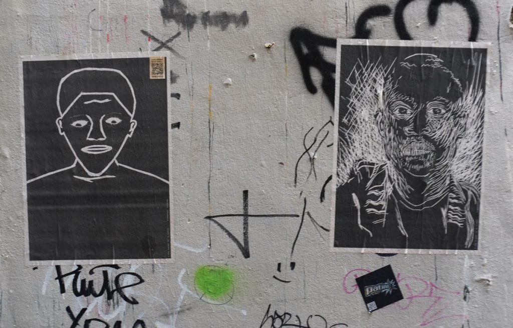 portraits, posters on an alley wall, part of A Paper Monument to the Paperless, a project by Domenique Himmelsbach de Vries 