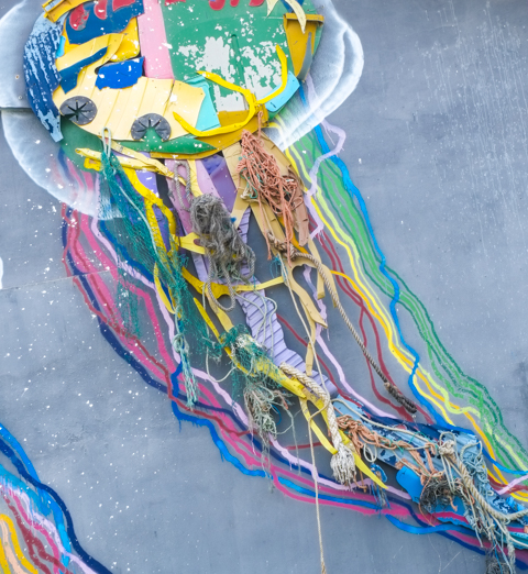 Bordalo artwork of a jellyfish on a blue building