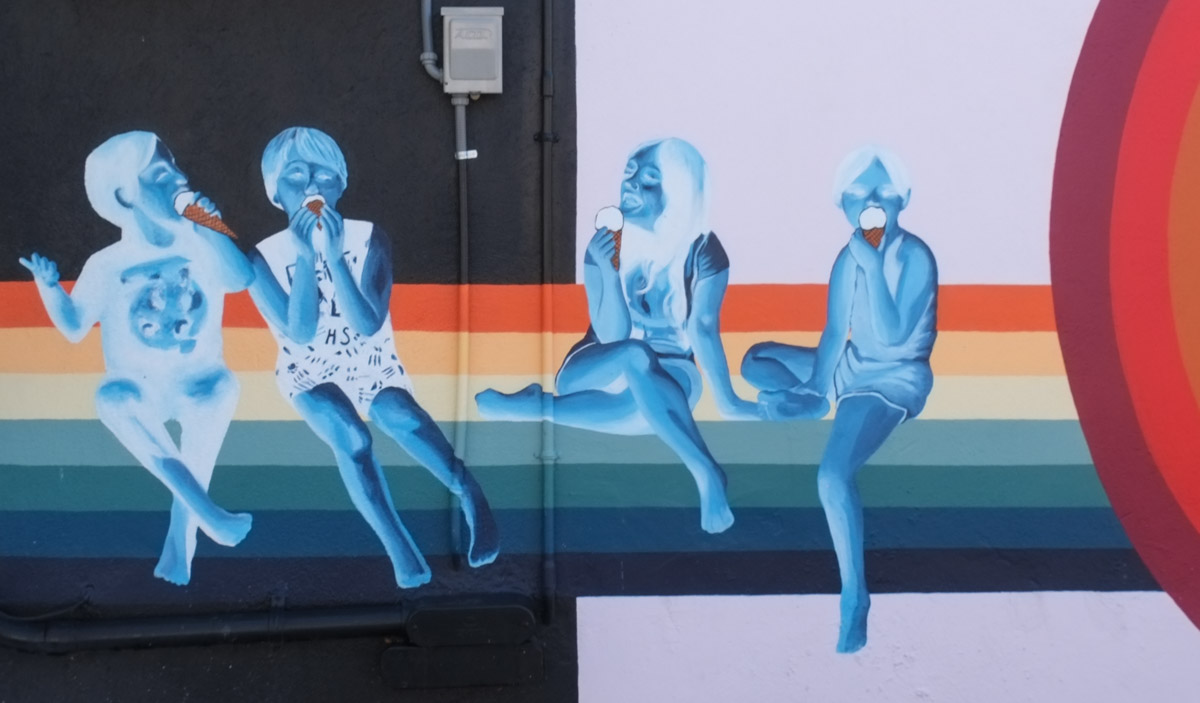 in a mural, a row of children eating ice cream cones