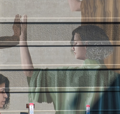 mural, larger than life size people, close up view of women and hands