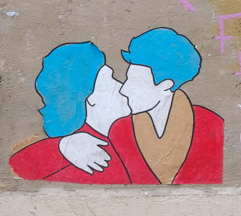 two people kissing, all painted in red, white, and blue