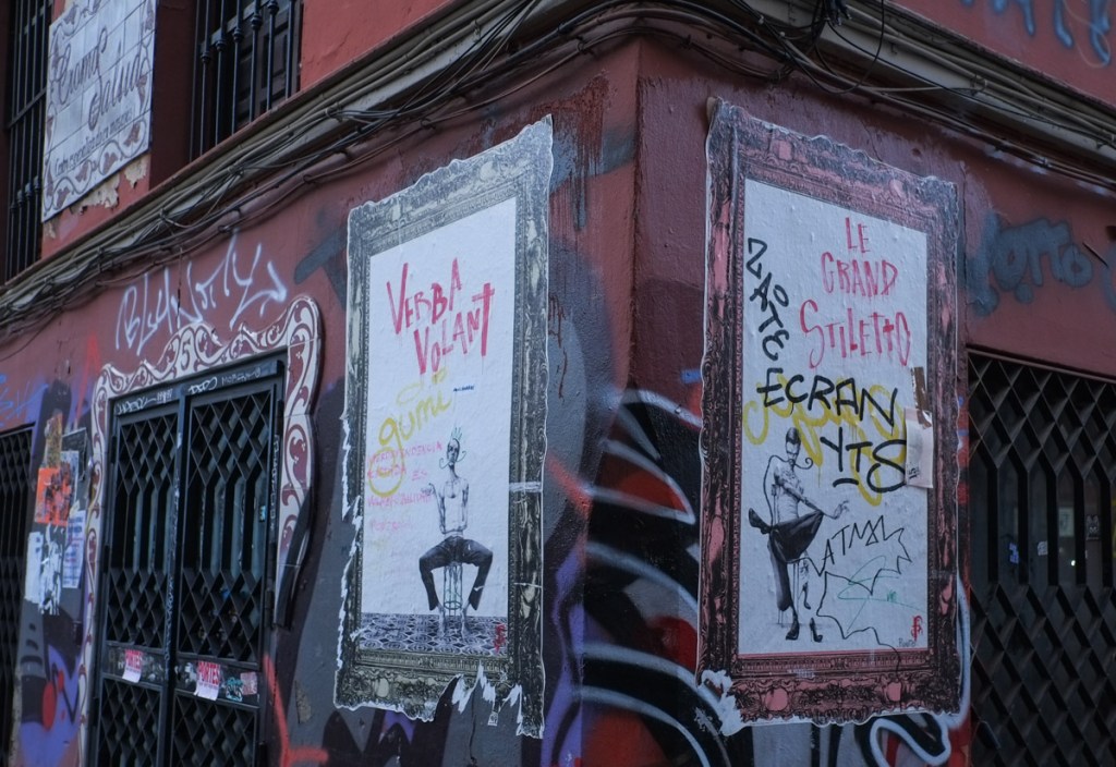 two drawings, both graphite on paper, by Adolfo Arenas Alonso as street art on a Seville street