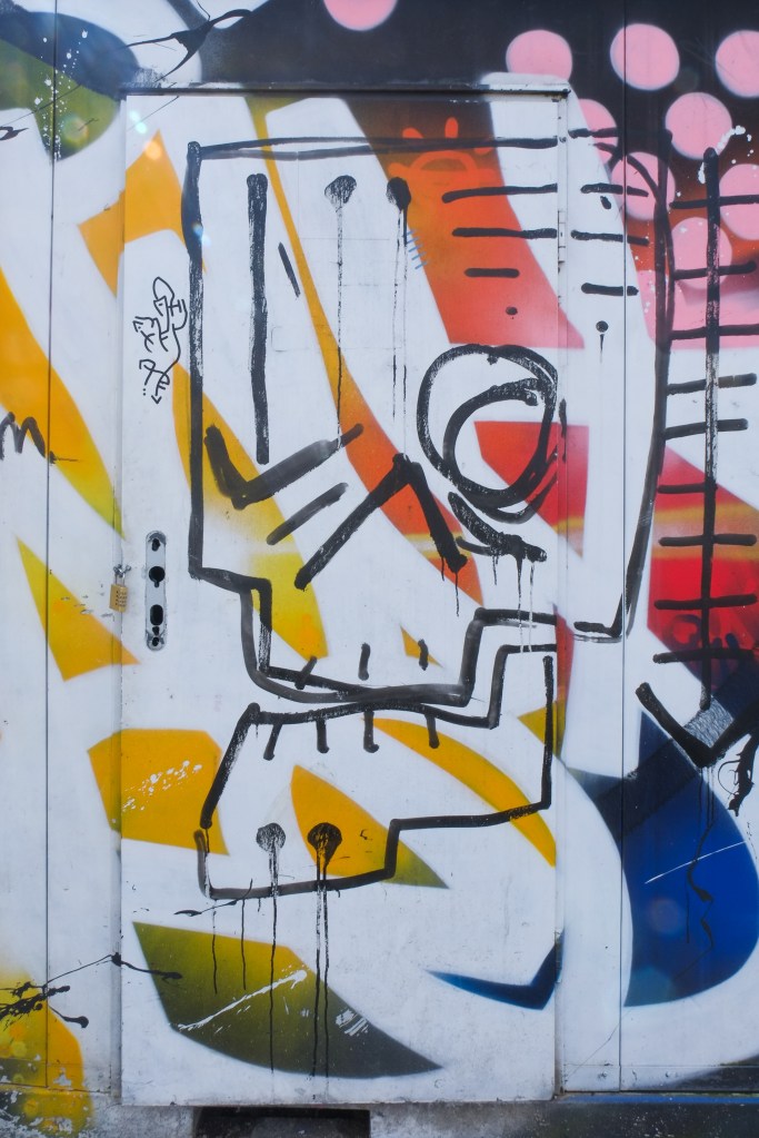 graffiti and street art covering a door