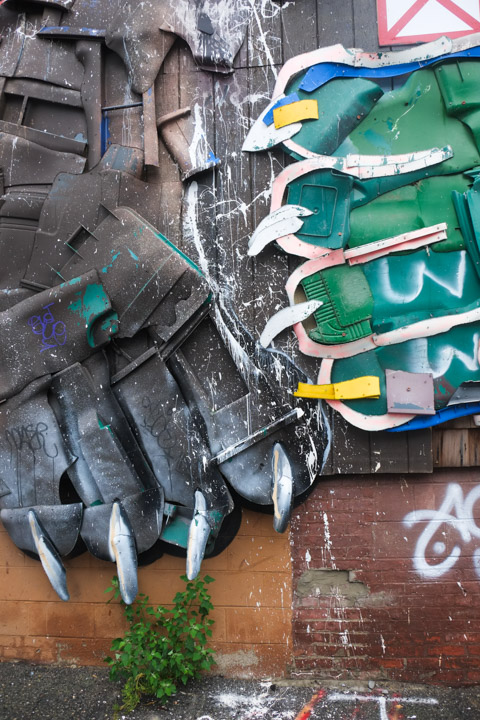 part of a street art piece by bordalo 2, bear paws with claws