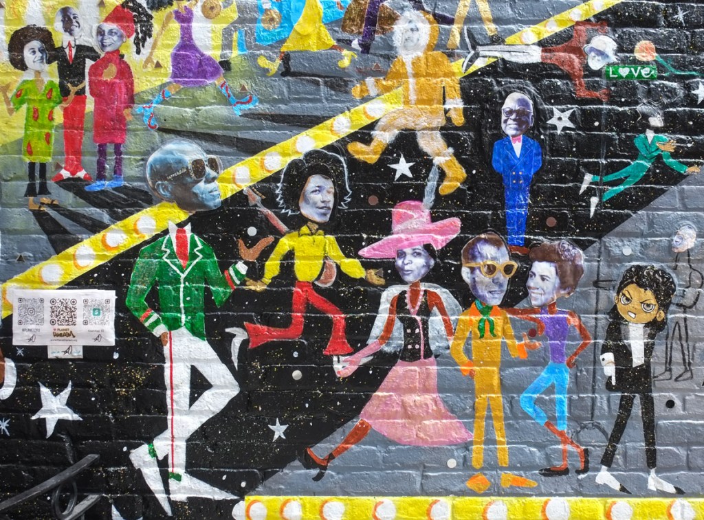 part of planet harlem mural by Paul Deo, Dapper Dan