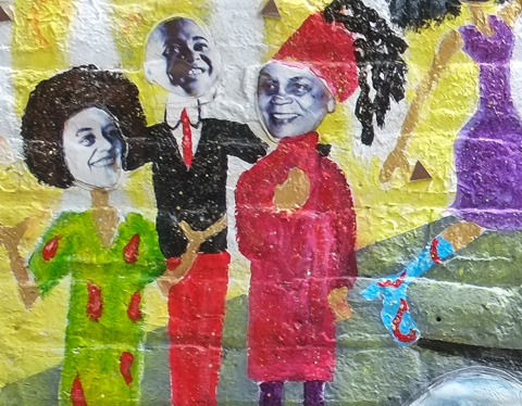three women in a mural