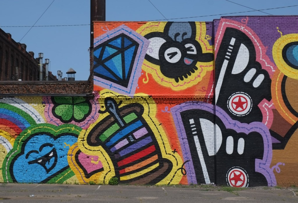 close up of part of a mural by golden 305 