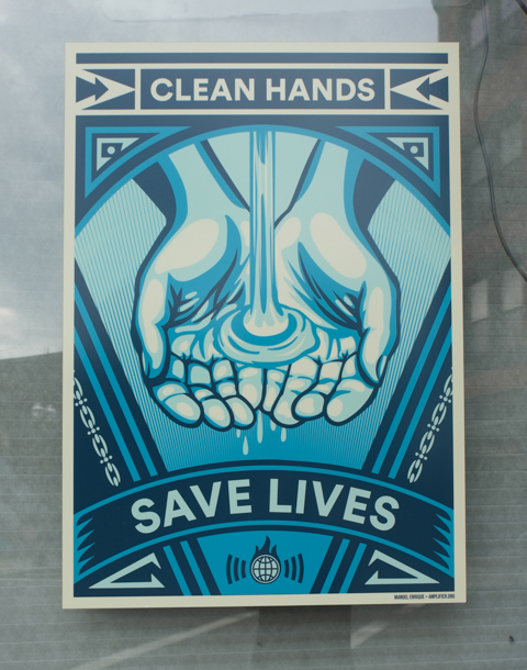 covid pandemic poster in Lynn Massachusetts, clean hands save lives, by manoel enrique