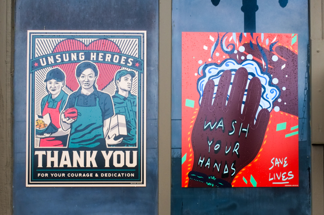 two covid pandemic posters in Lynn Massachusetts, unsung heroes thank  you to essential workers in the service industry as well as a reminder to wash your hands