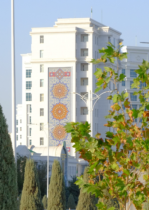murals, pictures, on the side of residential apartment buildings made of white marble, in ashgabat turkmenistan, based on traditionsl carpet patterns
