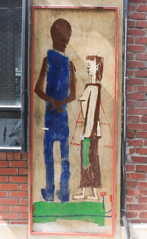 street art on a door, two people talking to each other, one on left is taller and darker