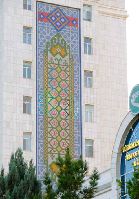 murals, pictures, on the side of residential apartment buildings made of white marble, in ashgabat turkmenistan