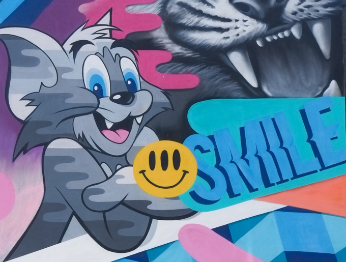 close up of mouse and word smile from greg mike mural in downtown worcester