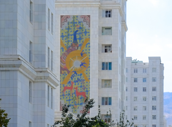 murals, pictures, on the side of residential apartment buildings made of white marble, in ashgabat turkmenistan