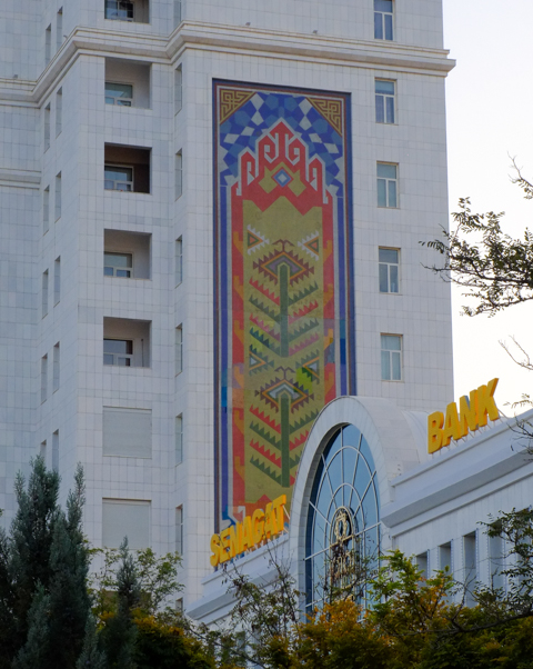 murals, pictures, on the side of residential apartment buildings made of white marble, in ashgabat turkmenistan, tree patterns