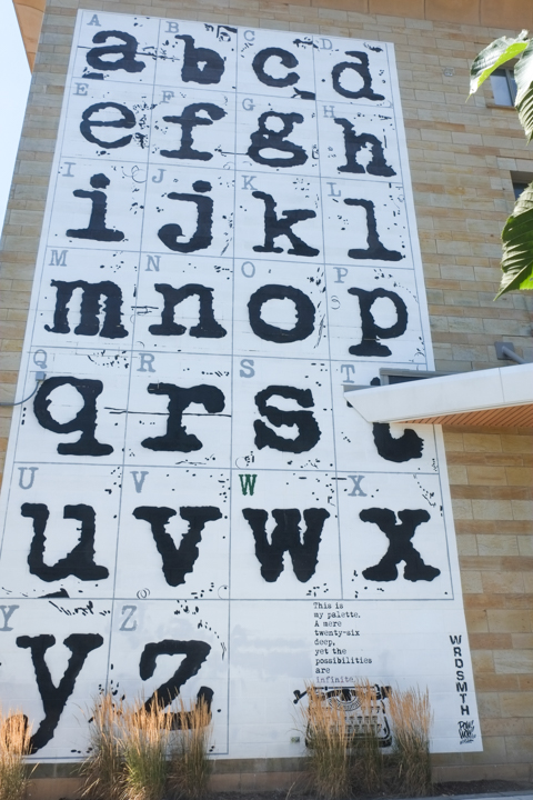 large mural by wrdsmth that is the letters of the alphabet, with a typewriter in the lower right corner, and the words: This is my palette.  A mere twenty-six deep, yet the possibilities are infinite